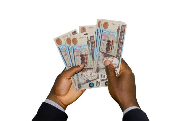 istock Black Hands in suit holding 3D rendered Guatemalan quetzal notes 1842479381