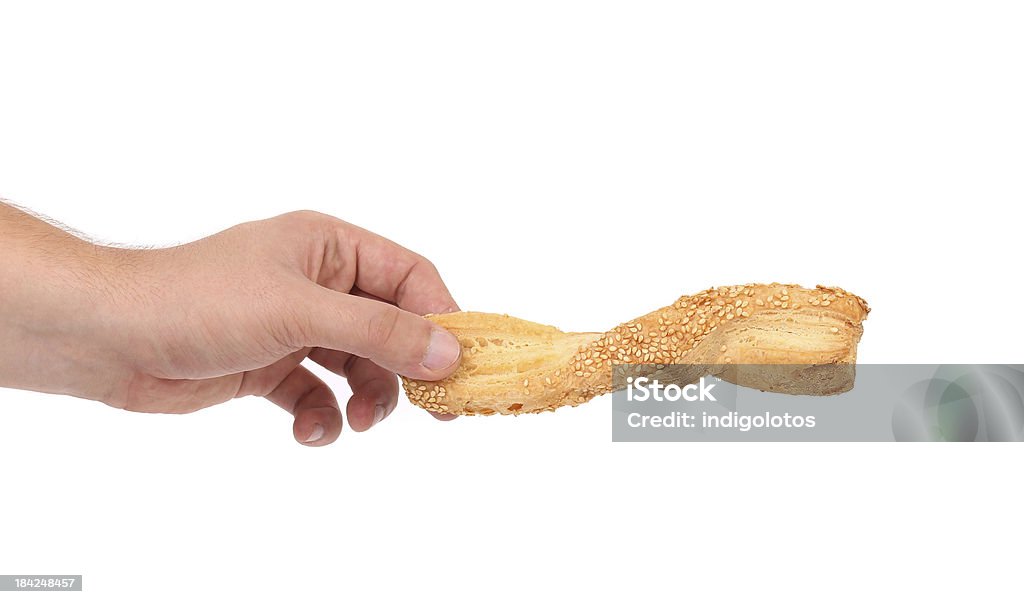 Mano tiene di brioche stick - Foto stock royalty-free di Bastone