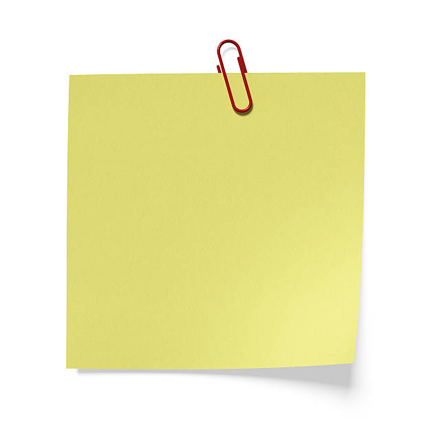 istock Red clip on a yellow paper 184250782