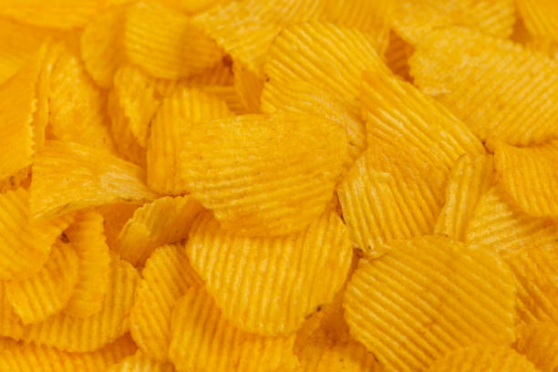istock ribbed potato chips - full-frame close-up background 1842549477