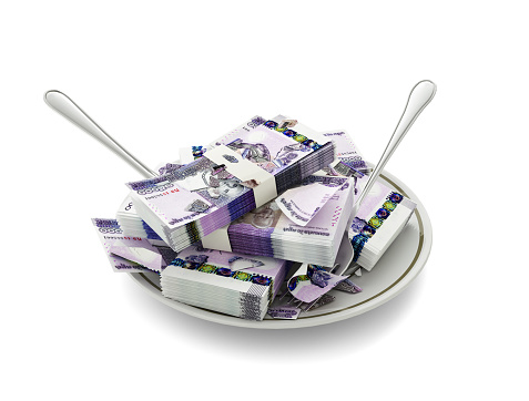 3D rendering of Cambodian riel notes on plate. Money spent on food concept. Food expenses, expensive meal, spending money concept. eating money, misuse of money