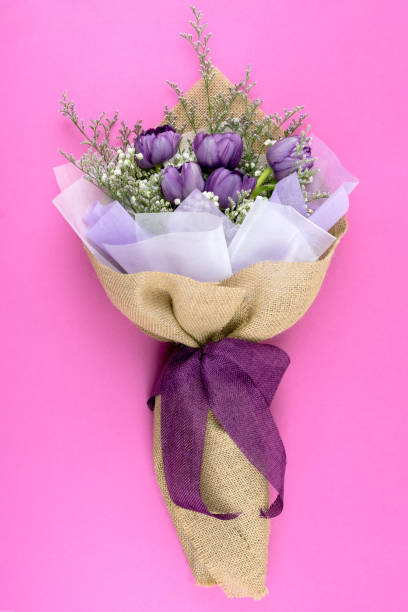 istock Purple Tulip Bouquet on Pink Background 1842578454