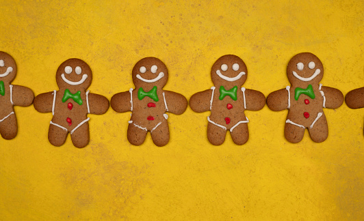 Twenty high-resolution gingerbread cookie people on pure white with slight shadow. Faces and expressions vary, some are odd and unusual, some are comical, and some are traditional.  All are delicious. 