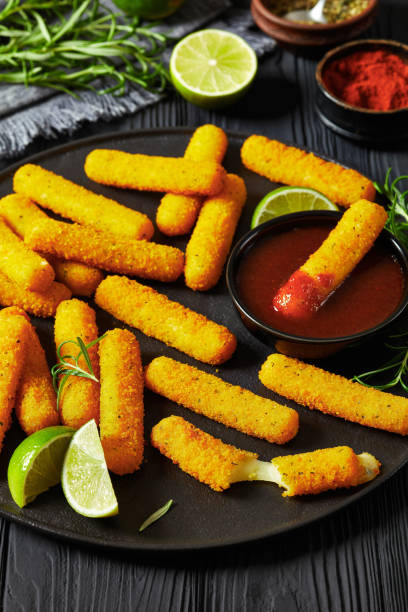istock fried mozzarella sticks with sauce on black plate 1842631306
