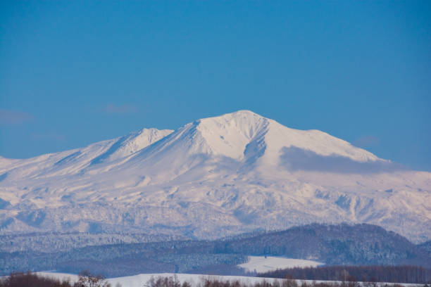 istock Snowy mountain summit and blue sky 1842650702