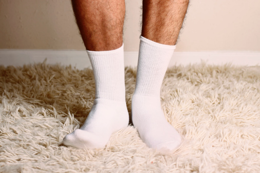 Man wearing white cotton socks.