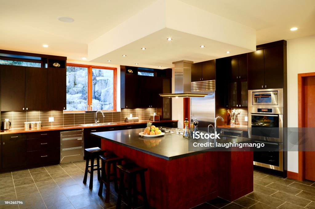 Modern kitchen home interior with dark cabinets modern kitchen home interior Appliance Stock Photo