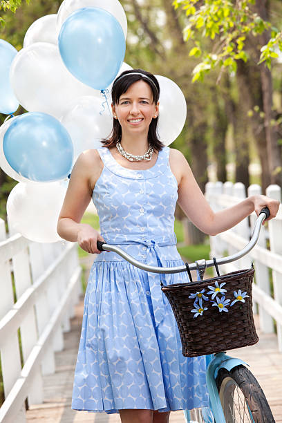 istock Smiling Women With Bicycle 184265852