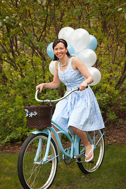 istock Smiling Women Riding Bicycle 184266100