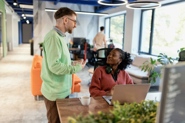 istock Businessman talking with his colleagues 1842662735