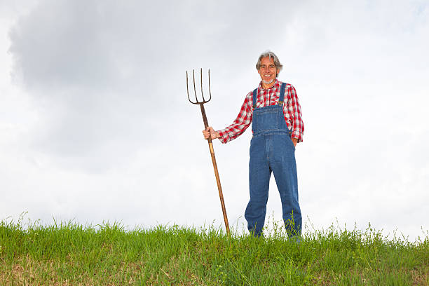 farmer standing at the top of a hill