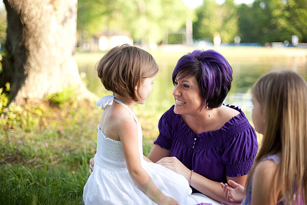 istock Young Stylish Mother Sitting with her Daughters 184266409