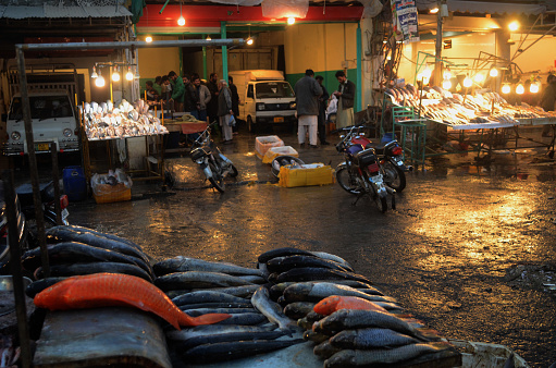 rawalpindi,pakistan :  fishes and sea foods are being selling at stall, as the demand of fish and sea food items have increases on the arrival of winter season located on Raja bazar area in rawalpindi