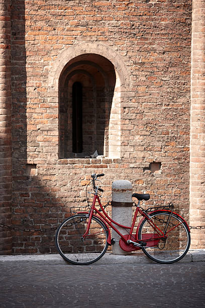 istock Red bicycle next to italian architecture 184266945