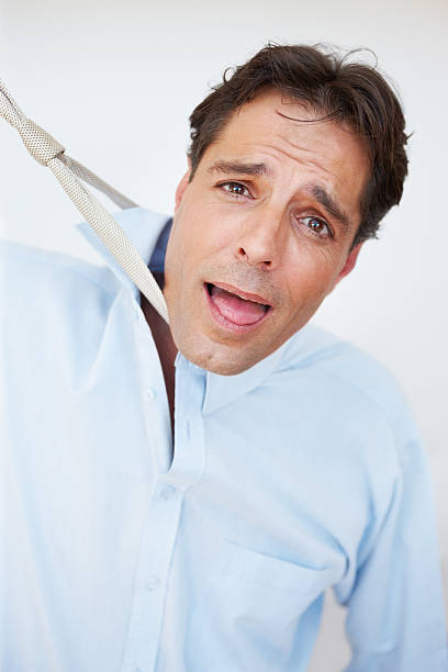 istock Frustrated man trying to strangle himself 184267400