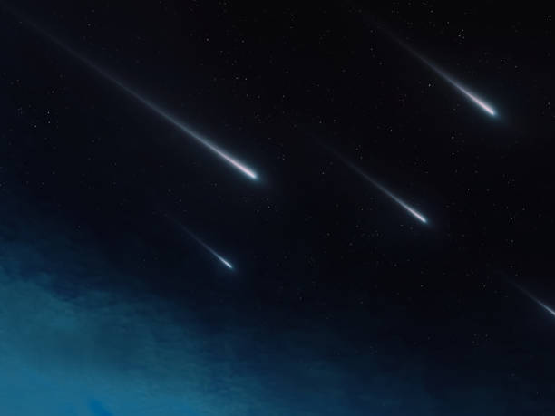 istock A stream of meteors lights up the night sky. 1842677120