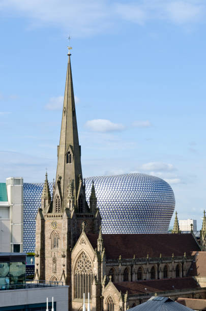 The bullring building in Birmingham, UK "The Victorian architecture of St Martin in the Bull Ring contrasts with the 21st Century exterior of Selfridges department store. The Bullring shopping district was re-developed in early 2000, the futuristic Selfridges department store was designed by Future Systems architecture practice and has won many awards." Bullring stock pictures, royalty-free photos & images
