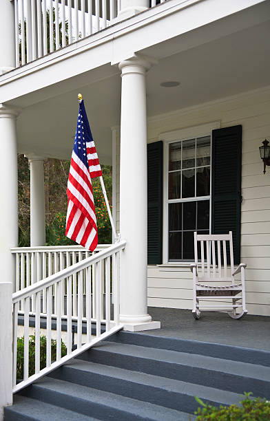 istock Front Porch with American Flag 184268581