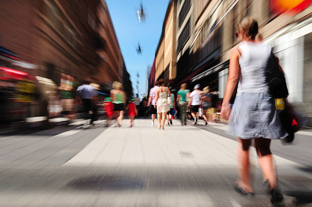 istock Pedestrians on sunlit street, zoom blur 184268870