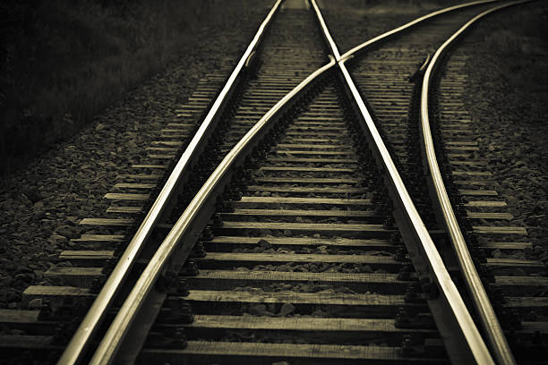 railroad track - railroad track direction choice transportation stock-fotos und bilder