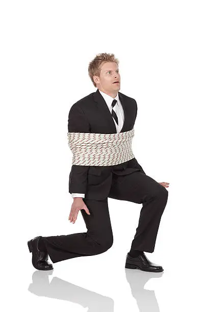 Businessman tied with ropehttp://www.twodozendesign.info/i/1.png