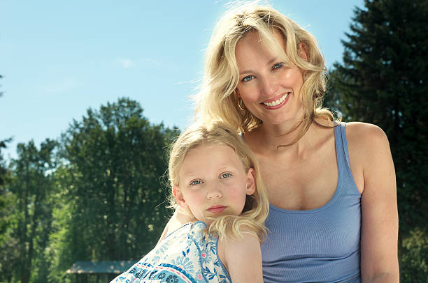 istock Young girl leaning against her mother 184269829