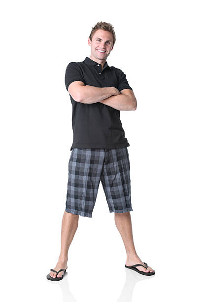 istock Happy man standing with arms crossed 184269960