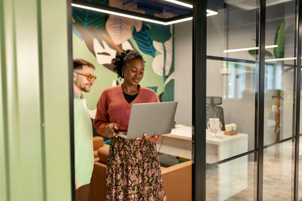 istock Woman talking with her colleague in the modern working space 1842700188