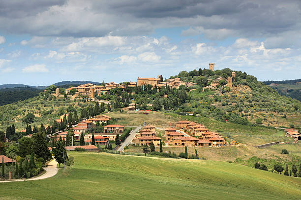 old church,stone well and houses in an ancient village,Volpaia,chianti region,tuscany,Italy.