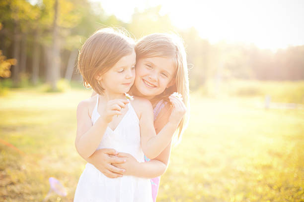 istock Hazy Backlit Image of Sisters Together 184270667