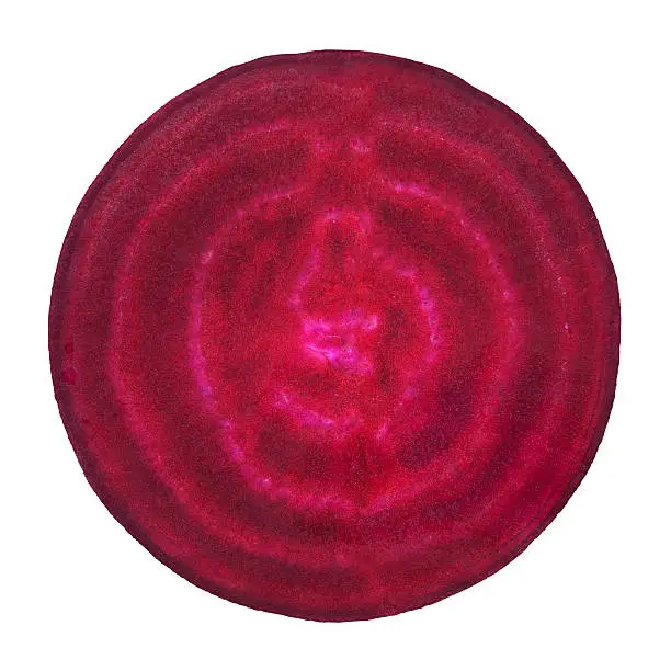 Beet circle portion on white background. Clipping path included.Some vegetables from