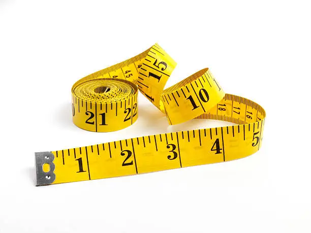 Photo of Tape measure in yellow measuring in inches