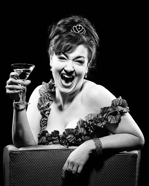 istock Laughing Retro Woman Drinking Cocktail 184271089