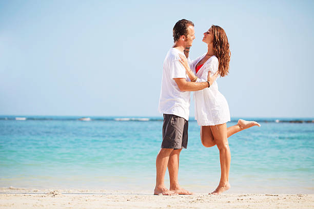 istock Happy couple hugging on the beach. 184271458