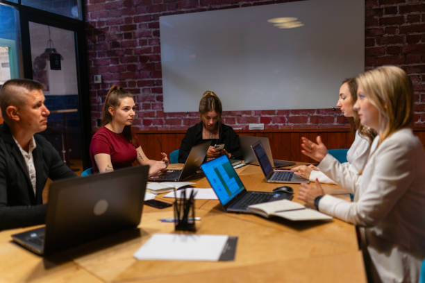 istock Young employees talk during brainstorm session at coworking 1842714742