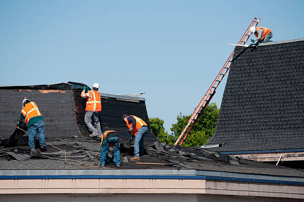 Roofing Crew At Work Roofing crew at work removing and replacing roof clad stock pictures, royalty-free photos & images