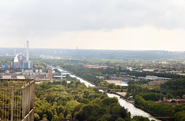 view over Oberhausen, with Rhein-Herne Kanal, highway (A42) and industrial buildings, seen from the roof of the Gasometer, which was formerly used to store gas, and is today a place where exhibitions take place and to allow visitor a view over the Ruhr area