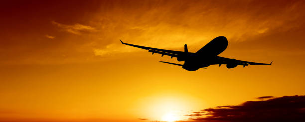 istock XL jet airplane taking off at sunset 184272729
