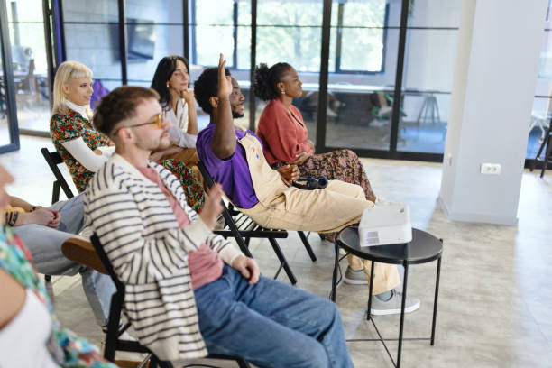 istock Man asking a question during a presentation in the IT company 1842727585