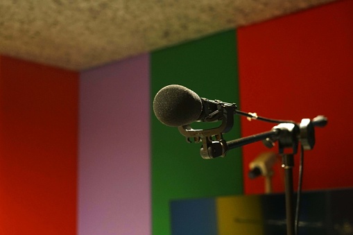 A microphone in the recording studio, background with copy space.