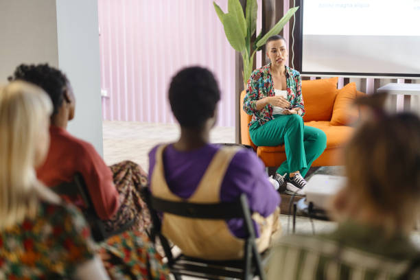 istock Female presenter interacting with people in the audience 1842731869