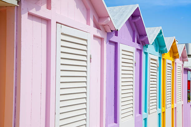 Beach huts in Rimini row of typical wooden beach cabanas in lovely pastel colorsOTHER BEACH SCENES FROM ITALY: beach hut stock pictures, royalty-free photos & images