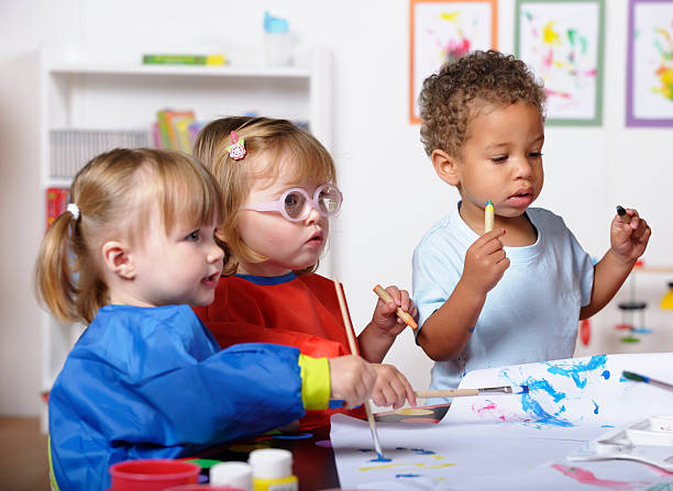 istock Group Of Toddlers Doing Art And Craft At Nursery 184273322