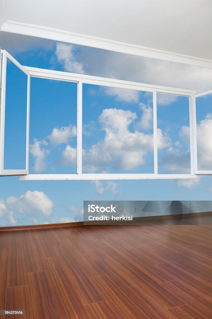 Empty room with mural of blue sky, white clouds and a window "Empty room with blue sky, no wall" Accessibility Stock Photo