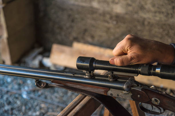 istock Close up for one rifle and hand on the optical sight; 1842740858