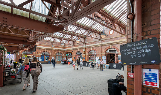 Birmingham Moor Street Railway Station booking hall interior with passengers in Birmingahm, West Midlands, UK on 23 July 2023
