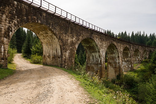 Century old stone build railway viaduct (arch bridge) in Vorokhta town, Ukraine
