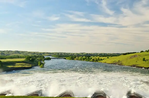 Water gushes out of the Oahe Dam lake in an effort to control flooding upstream from Pierre South Dakota on the Missouri river. This energy is being used to generate electricity for the north central part of the US.