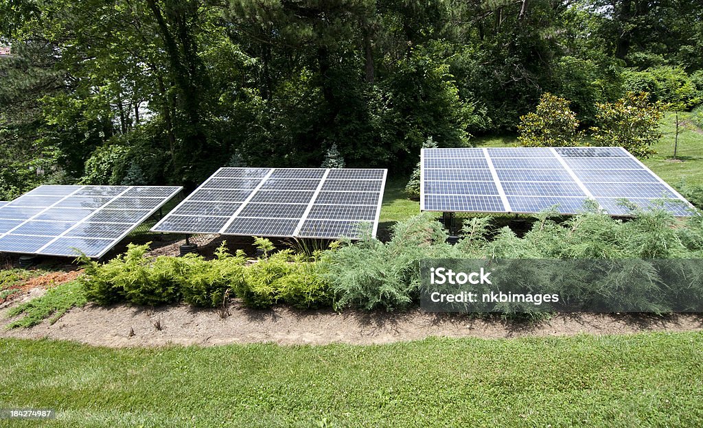 Three solar panels in the sunlight Row of three solar panels in the sunlight. Color Image Stock Photo