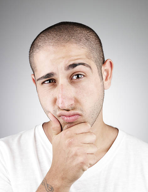 istock Man with hand on chin with thoughtful expression on face. 184275213